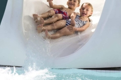 Lifestyle_Kids-on-Water-slide_Peter-Arnell